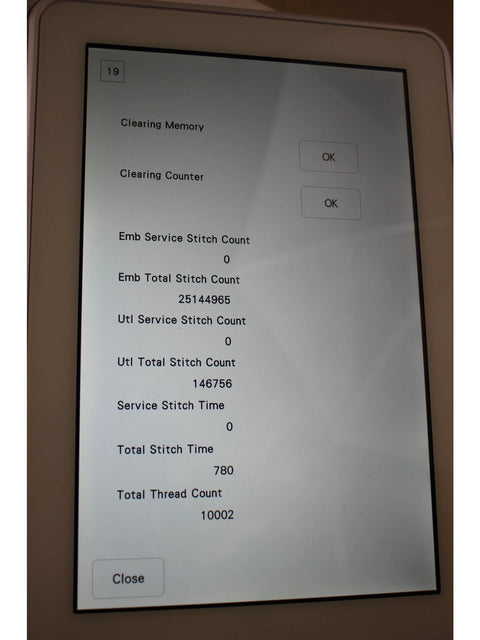 A close-up of the Brother Luminaire Innov-is XP1 screen displaying stitch counts and memory options.