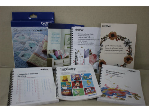 A collection of Brother sewing and embroidery machine manuals and software boxes.