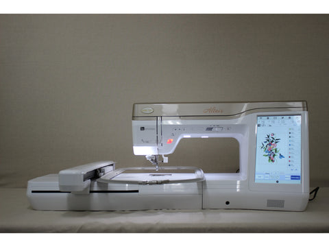A white Baby Lock Altair sewing and embroidery machine with a floral design on its screen.