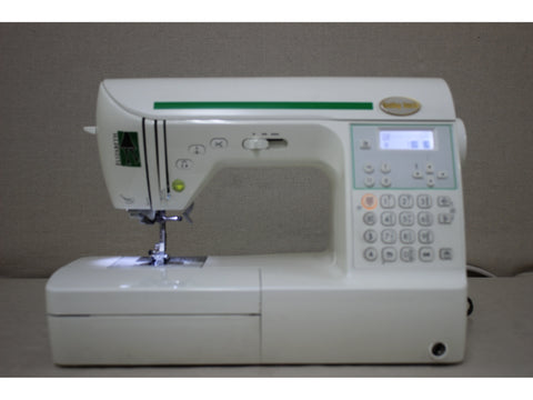 A white Baby Lock Elizabeth sewing machine with green accents and a digital display.