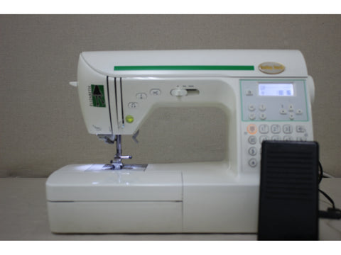 A pre-owned Baby Lock Elizabeth sewing machine with a foot pedal.