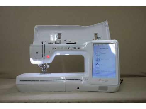 A white Brother Stellaire Innov-is XJ1 sewing and embroidery machine with an open top and a lit touchscreen.