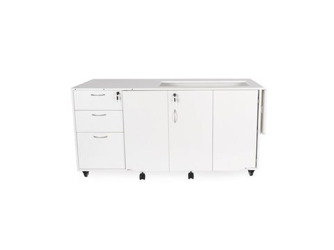 White sewing and serger cabinet on wheels with drawers and cabinet doors.