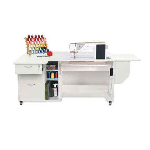 A white sewing and serger cabinet with an electric lift, storage, and a thread rack.