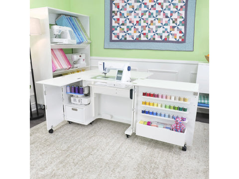 A white sewing cabinet with an electric lift, storage, and a sewing machine.