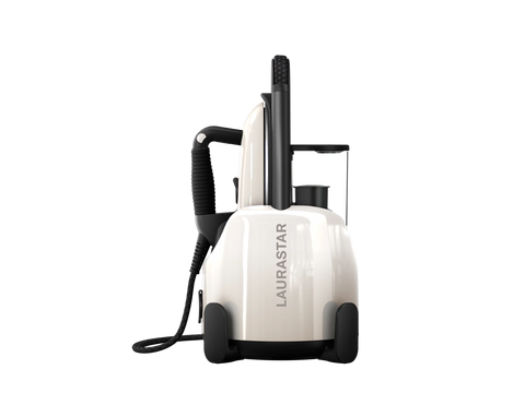 A white Laurastar Lift portable steam iron with a black handle and cord.