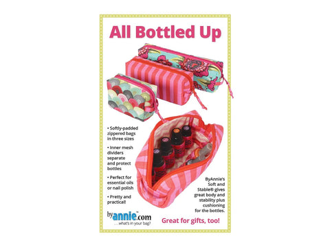 Three zippered bags in varying sizes, one open to show bottles inside.