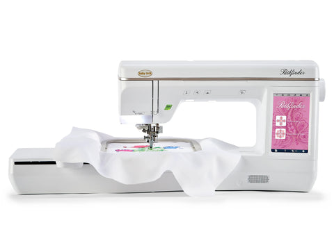 White Baby Lock Pathfinder embroidery machine with a colorful design on fabric in the hoop.