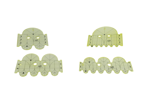 Four translucent yellow quilting rulers with black markings are displayed on a black background.