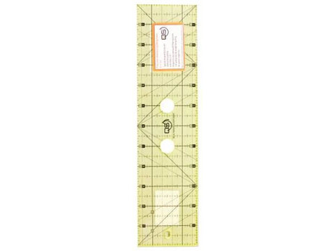 A clear yellow Quilters Select 3 by 12 inch machine quilting ruler with grid lines.