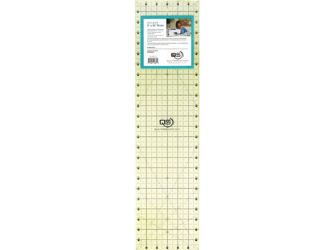 A clear 6x24 inch Quilters Select non-slip quilting ruler with grid lines and a product label.
