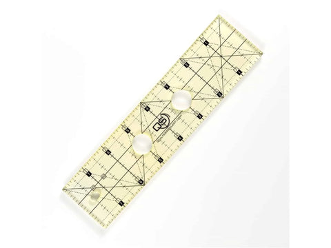 A clear 2x8 inch Quilters Select non-slip quilting ruler with black markings.