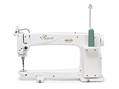 A white Baby Lock Regent 18-inch sit-down quilting machine with a spool of teal thread.
