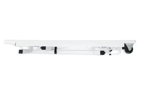 A white sewing table with black accents and wheels, folded for storage.