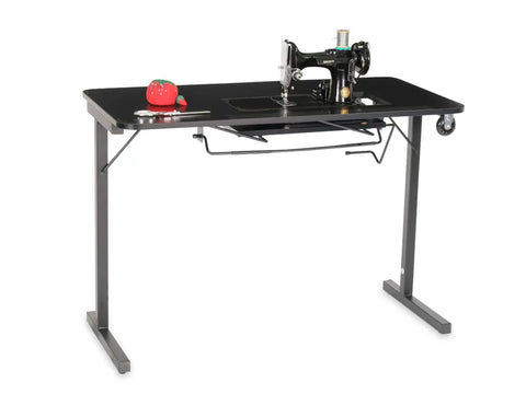 Black Arrow Heavyweight Sewing Table with a Singer Featherweight machine and sewing accessories.