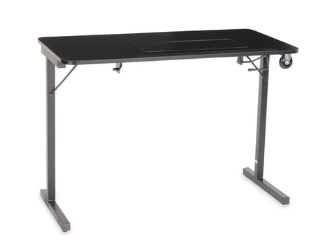Black sewing table with a two-position manual lift and wheels on one side.
