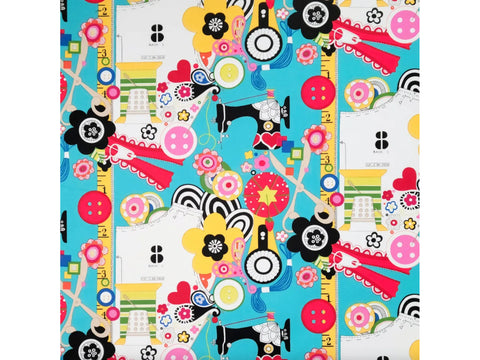 A vibrant fabric with a sewing-themed pattern on a bright blue background.
