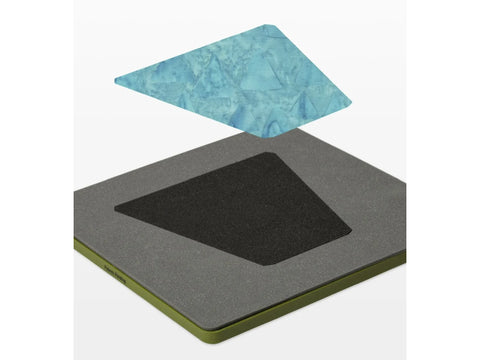 A blue fabric tumbler shape floats above a gray AccuQuilt GO! Tumbler die.