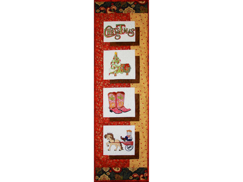 A quilted wall hanging with four embroidered Christmas-themed squares.