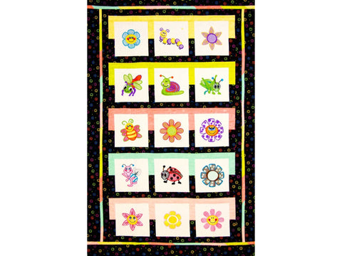 A quilt featuring embroidered bugs and flowers on white squares with colorful borders.