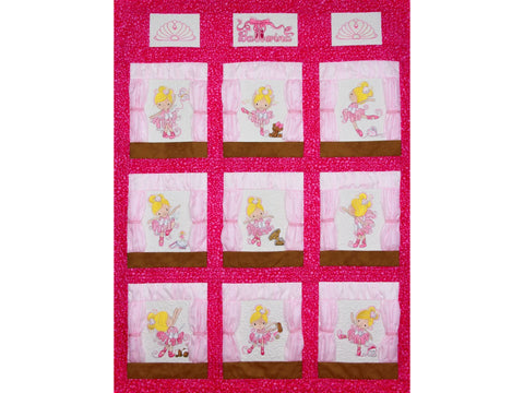 A pink quilt features nine embroidered ballerina squares and three top panels with crowns and "Ballerina" text.