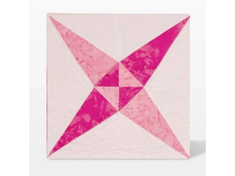 A quilt block with a pink four-point star design on a light background.