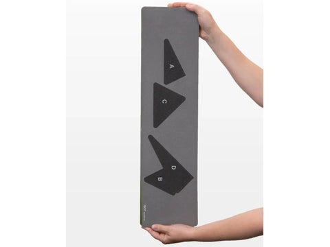 A person holds a gray AccuQuilt GO! Starry Path die with shapes A, B, C, and D.