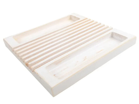 White wooden quilter's ruler holder with slatted top and two open trays.
