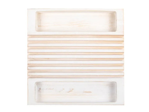 A white wooden ruler holder with horizontal slats and two recessed trays.