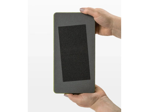 A person holds an AccuQuilt GO! Square die with a 3-1/2 inch square shape.