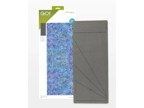 AccuQuilt GO! Strip Cutter with a blue patterned fabric and a gray cutting mat.