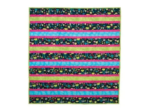 A colorful quilt with horizontal stripes of floral patterns, lime green, hot pink, and light blue.