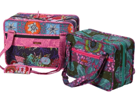 Two floral patterned quilted bags, one pink and one teal, are displayed.