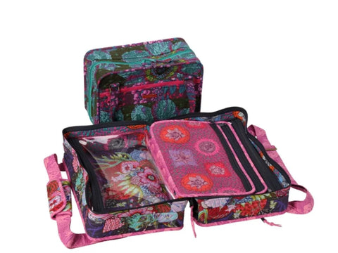 Two floral patterned bags, one closed and one open, display multiple compartments.