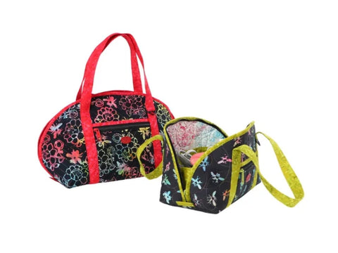 Two colorful quilted bags, one red and black with flowers, the other green and black with dragonflies.