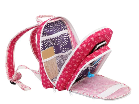 Pink and purple patterned backpack with multiple open compartments and pockets.