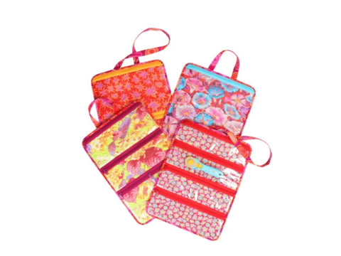 Four colorful fabric organizers with zippers and handles are displayed.