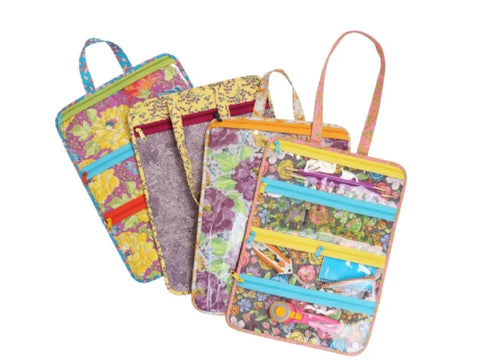 Four floral fabric organizers with colorful zippers and clear pockets are displayed.