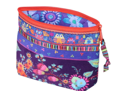 A colorful fabric pouch with an orange zipper, featuring owls, flowers, and striped patterns.