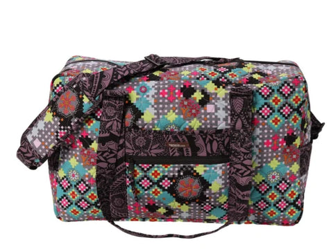 Round Trip Duffle bag with a colorful geometric and floral pattern.
