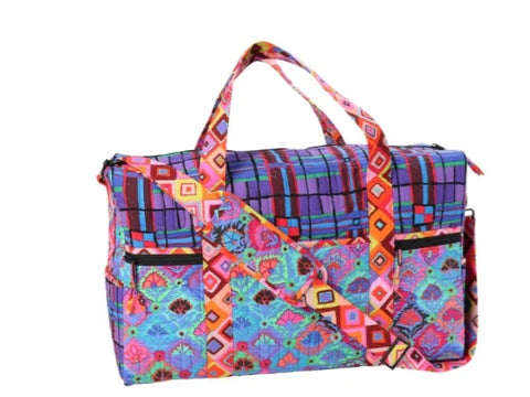 Colorful patterned travel duffle bag with top handles and a shoulder strap.