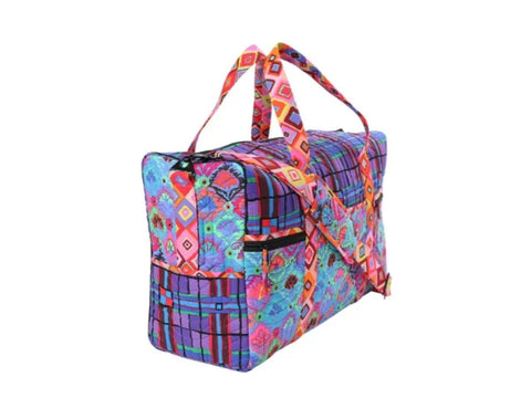 Colorful patterned travel duffle bag with top handles and a side zipper pocket.