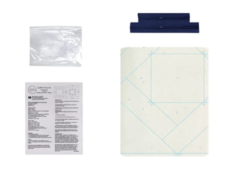 Two navy blue zipper project bags, a clear plastic bag, and instructions for quilting.