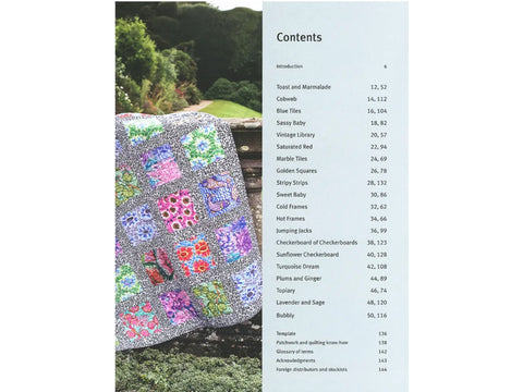 A book titled "Kaffe Fassett Quilts in Wales" open to the table of contents, with a colorful quilt on the left page.