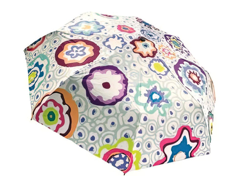 A Kaffe Fassett umbrella with a vibrant aqua floral pattern.