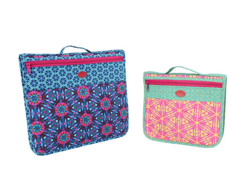 Two quilted fabric pouches with geometric patterns and pink zippers.
