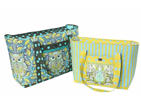 Two large quilted tote bags, one with an owl print and the other with a rabbit print.