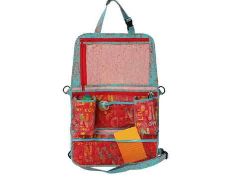 A colorful backseat organizer with multiple pockets and a clear top compartment.