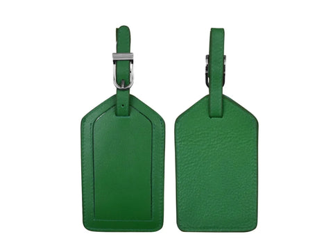 Emerald green leather luggage tag blanks, one with a visible ID window and one with a textured surface.