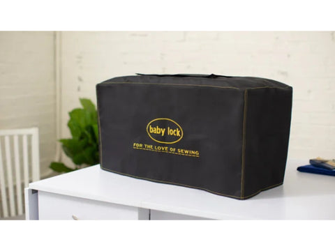 Baby Lock XL sewing machine dust cover in black with yellow stitching.